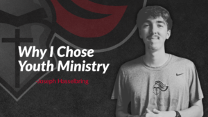 Young man in a t-shirt stands in front of a shield logo with text: “Why I Chose Youth Ministry - Joseph Hasselbring” on a dark background.
